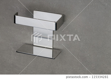 Chrome Bathroom Accessory on Gray Wall 115334281