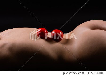 Red apple of Beautiful female body. Seductive booty of young woman. Naked woman 115334401