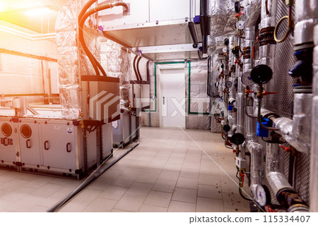 Interior industrial gas boiler with a lot of piping, pumps and valves 115334407