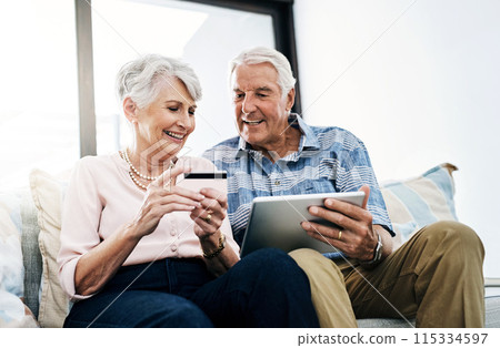 Senior couple, home and tablet with credit card on sofa for online shopping, payment and retirement plan. People, happy and couch at living room for internet banking, budget and investment or finance Senior couple, home and tablet with credit card on sofa for online shopping, payment and retirement plan. People, happy and couch at living room for internet banking, budget and investment or finance 115334597