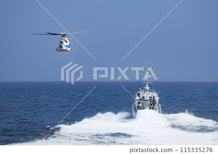 Helicopters and patrol boats during exercise Helicopters and patrol boats during exercise 115335276