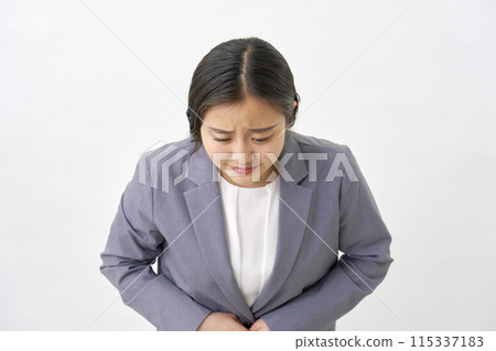 Apologizing young business woman on white background 115337183