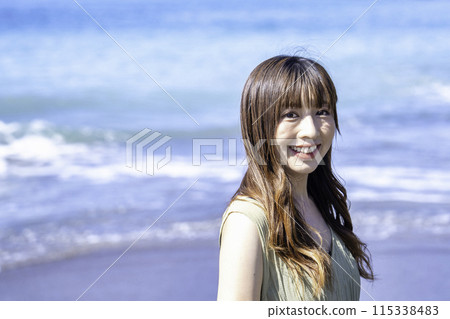 A woman enjoying the sea 115338483