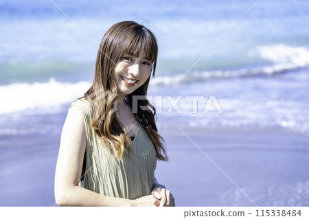 A woman enjoying the sea 115338484