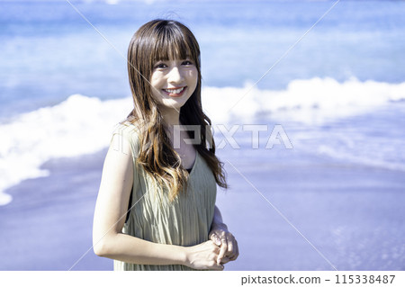 A woman enjoying the sea 115338487