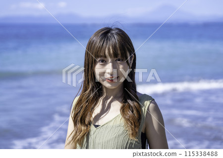 A woman enjoying the sea 115338488