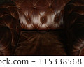 Vintage Brown Leather Chesterfield Sofa Close-up Detail 115338568