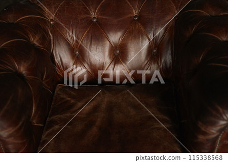 Vintage Brown Leather Chesterfield Sofa Close-up Detail Vintage Brown Leather Chesterfield Sofa Close-up Detail 115338568