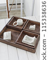 Rustic Wooden Serving Tray with White Ceramicware on a Bright Interior Setup 115338636