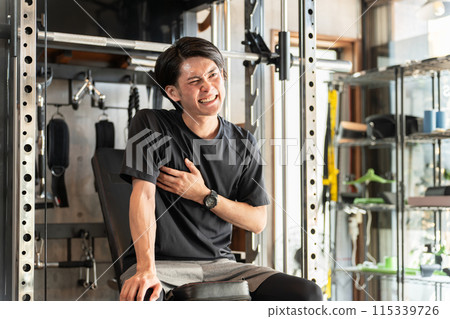 Young athlete Asian male with accumulated fatigue in the gym (overwork, hard training) 115339726