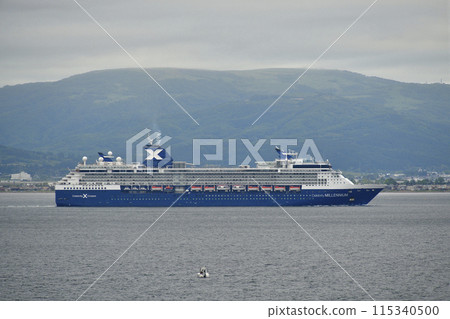 Photographing the cruise ship Celebrity Millennium sailing through Hakodate Bay in Hakodate, Hokkaido in early summer 115340500