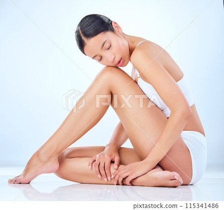 Legs, beauty and woman in studio for hair removal, cleaning and luxury or glow for skin care. Underwear, body and female person with epilation for dermatology or laser treatment by white background Legs, beauty and woman in studio for hair removal, cleaning and luxury or glow for skin care. Underwear, body and female person with epilation for dermatology or laser treatment by white background 115341486