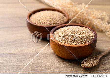 Brown quinoa seed in bowl with spoon on wooden background, Healthy food ingredient Brown quinoa seed in bowl with spoon on wooden background, Healthy food ingredient 115342061