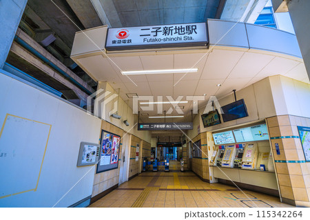Kawasaki cityscape in June, Japan. View of the west exit of Futako-Shinchi Station under the elevated tracks. 115342264