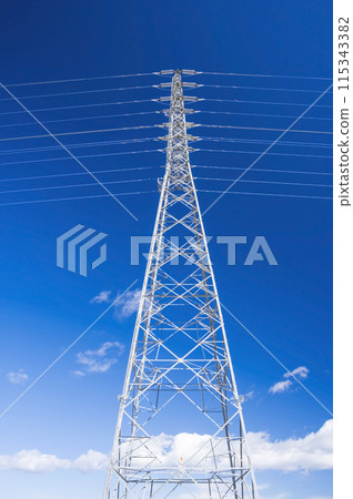 Transmission tower against the blue sky 115343382