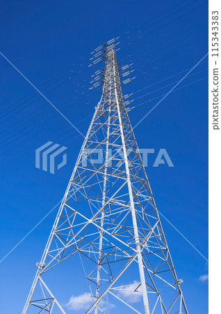 Transmission tower against the blue sky 115343383