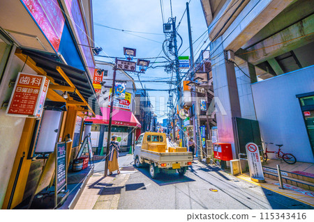 Kawasaki cityscape in Japan in June. The east exit of Futako-Shinchi Station under the elevated railway. View of the shopping street in front of the station, Shoei-kai Shopping Street, etc. 115343416