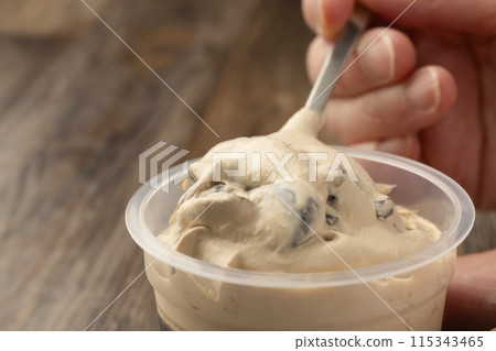 Coffee jelly in a spoon-shaped cup container Coffee jelly in a spoon-shaped cup container 115343465