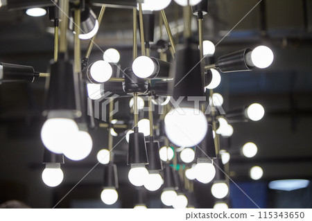Industrial hanging lights bring bright illumination and stylish decor to modern interiors 115343650