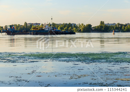 Industrial ship on the Dnieper river in Kremenchug, Ukraine 115344241