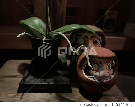 Plants growing on Daruma dolls Plants growing on Daruma dolls 115345166