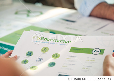 close up diversity team brainstorming focused on ESG (environment,social,governance)  for sdgs goals in a sustainable green office 115346435