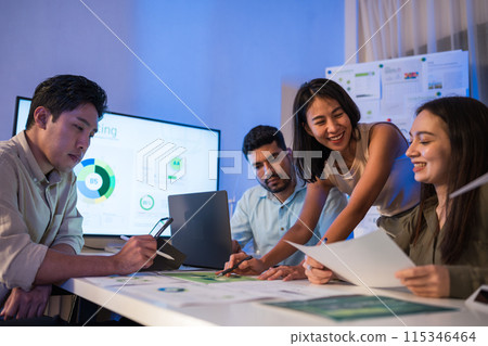 diversity team brainstorming focused on ESG (environment,social,governance)  and renewable energy to reduce pollutions in a sustainable green office at night 115346464