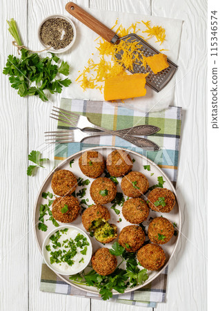 fried broccoli cheese balls with sour cream sauce 115346574