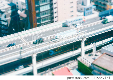 Aerial view of a line of cars on a highway Aerial view of a line of cars on a highway 115347161