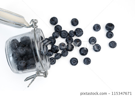 blueberries in glass jar isolated on white background 115347671