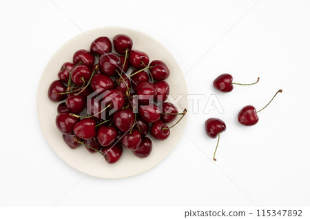 cherry in ceramic plate isolated on white 115347892