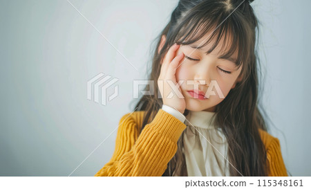 Image of a young woman suffering from headache and stress. 115348161