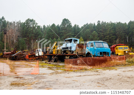 Old rusty abandoned damaged trucks in Chernobyl exclusion zone, Ukraine 115348707