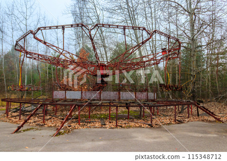 Old rusty carousel in amusement park of ghost town Pripyat in Chernobyl Exclusion Zone, Ukraine Old rusty carousel in amusement park of ghost town Pripyat in Chernobyl Exclusion Zone, Ukraine 115348712