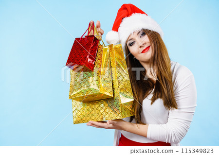 Happy Christmas woman with paper gift bags Happy Christmas woman with paper gift bags 115349823