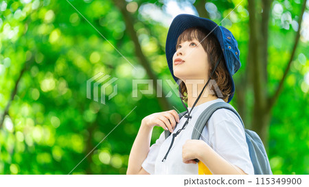 Young woman enjoying trekking in nature 115349900