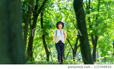 Young woman enjoying trekking in nature Young woman enjoying trekking in nature 115349910