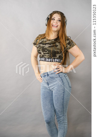 Teen women wearing headphones Teen women wearing headphones 115350123