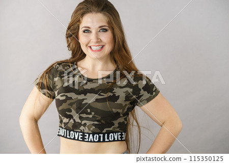 Beautiful young woman with brown hair 115350125