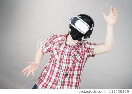 Gamer man wearing VR Gamer man wearing VR 115350159