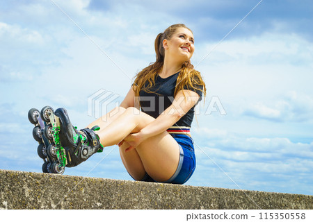 Fit girl with roller skates outdoor Fit girl with roller skates outdoor 115350558