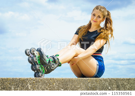 Fit girl with roller skates outdoor Fit girl with roller skates outdoor 115350561