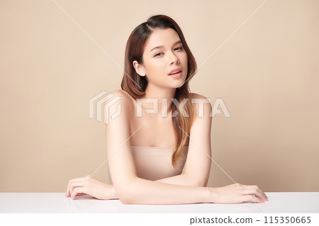 Beautiful young asian woman with clean fresh skin on beige background, Face care, Facial treatment, Cosmetology, beauty and spa, Asian women portrait. 115350665