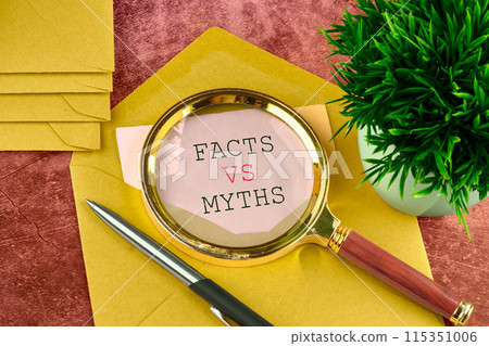 Business, financial and fact vs myth concept. Copy space. Concept words, symbol Fact vs myth on a piece of paper sticking out of a mail envelope 115351006