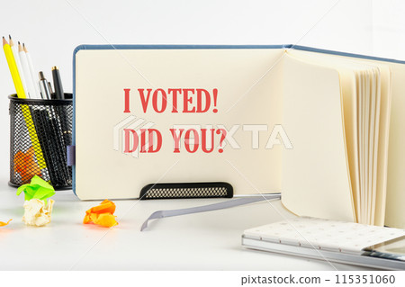 Concept words I voted. I voted. Did you symbol. on a blank sheet of an open business notebook Concept words I voted. I voted. Did you symbol. on a blank sheet of an open business notebook 115351060