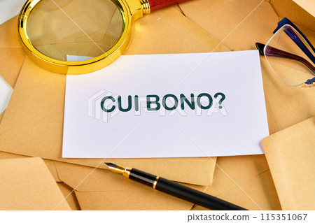 CUI BONO (to whose benefit) question on a blank sheet near a pen, magnifying glass and glasses 115351067