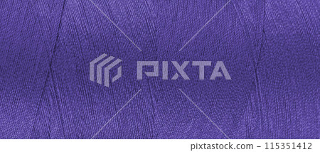 Texture of purple color threads in spool close up, macro. Wide banner, header 115351412