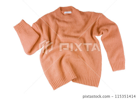 Orange flying crumpled women's autumn knitted sweater isolated on white background 115351414