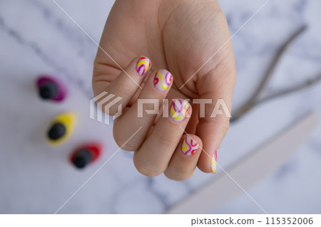 Stylish colorful summer female nails. Modern trendy stylish Beautiful manicure. Cute pastel nail minimalistic design concept of beauty treatment. Gel nails. Skin care Stylish colorful summer female nails. Modern trendy stylish Beautiful manicure. Cute pastel nail minimalistic design concept of beauty treatment. Gel nails. Skin care 115352006