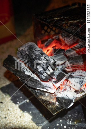 Burning charcoal 115352285